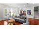 Comfortable living area with hardwood floors, french doors, and views of the kitchen and staircase at 131 Miramar Ne Blvd, St Petersburg, FL 33704