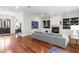 Open-concept living room featuring a fireplace, built-in bookshelves, and hardwood floors at 131 Miramar Ne Blvd, St Petersburg, FL 33704