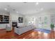 Bright living room with hardwood floors, fireplace, and french doors to the outdoors at 131 Miramar Ne Blvd, St Petersburg, FL 33704
