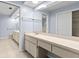 Bathroom featuring a long countertop with and sinks, tile floors, and neutral paint at 14164 Fennsbury Dr, Tampa, FL 33624