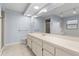 Bathroom featuring double vanity, shower and tub in an open concept design with neutral tiling and countertops at 14164 Fennsbury Dr, Tampa, FL 33624