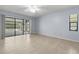 Bedroom with tile flooring and sliding door access to the screened-in pool area at 14164 Fennsbury Dr, Tampa, FL 33624