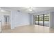 Bedroom featuring neutral paint, tile floors and sliding door access to the pool at 14164 Fennsbury Dr, Tampa, FL 33624
