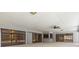 Lanai featuring a bar, sliding doors, and backyard views at 14164 Fennsbury Dr, Tampa, FL 33624