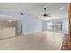 Inviting living room with tile flooring, natural light, and an open layout connecting to a nearby bar area at 14164 Fennsbury Dr, Tampa, FL 33624