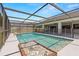 Inviting screened pool with safety fence and surrounded by a patio, perfect for relaxation and entertaining at 14164 Fennsbury Dr, Tampa, FL 33624