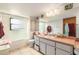 Hall bathroom features a shower/tub combo, vanity with ample counter space, and natural light at 159 Canby Cir, Spring Hill, FL 34606