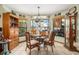 Cozy breakfast nook featuring tiled floors, large windows, and custom decor, perfect for enjoying casual meals and relaxing at 159 Canby Cir, Spring Hill, FL 34606