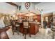Open-concept kitchen showcasing a bar area with seating, overhead lighting, and seamless connection to the adjacent living spaces at 159 Canby Cir, Spring Hill, FL 34606