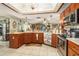 Bright kitchen with stainless steel appliances, ample counter space, custom cabinets, and open layout for a delightful cooking experience at 159 Canby Cir, Spring Hill, FL 34606