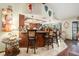 Spacious kitchen featuring a breakfast bar with seating, chandeliers, and open layout, perfect for entertaining guests and Gathering at 159 Canby Cir, Spring Hill, FL 34606