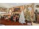Living room displaying a stone fireplace, hardwood floors, and plenty of natural light at 159 Canby Cir, Spring Hill, FL 34606