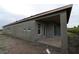 The back of a home with stucco walls, and a covered patio at 1614 Running Tide Pl, Sarasota, FL 34240