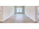 The dining room features wood-style floors, a modern chandelier, and a bright window providing an inviting space at 16425 66Th E Ln, Parrish, FL 34219