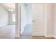 Bright entryway features wood-style floors, white trim, and an open view into the adjacent living space, creating an inviting ambiance at 16425 66Th E Ln, Parrish, FL 34219