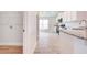 Open concept kitchen featuring stainless appliances, granite countertops and wood-style floors with ample natural light at 16425 66Th E Ln, Parrish, FL 34219