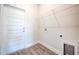 Bright laundry room featuring tile flooring, ample storage, and white trim for a clean and functional space at 16425 66Th E Ln, Parrish, FL 34219