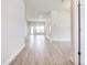 Bright, open living room with wood-look tile flooring and lots of natural light at 16425 66Th E Ln, Parrish, FL 34219