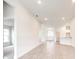 Spacious living room with wood-look tile, recessed lighting, and plenty of natural light at 16425 66Th E Ln, Parrish, FL 34219