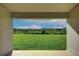 Expansive green space and community views from this home's screened lanai offers serene outdoor living at 16425 66Th E Ln, Parrish, FL 34219