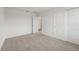 Inviting bedroom with soft carpet, a closet, and access to the rest of the home at 1829 Draughton Dr, Zephyrhills, FL 33541