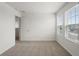 Comfortable bedroom with carpet, dual windows, and an open doorway to other rooms at 1829 Draughton Dr, Zephyrhills, FL 33541