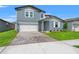 Charming two-story home with a two-car garage, landscaped yard, and inviting entrance at 1829 Draughton Dr, Zephyrhills, FL 33541