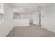 Bright loft space with neutral carpet and white walls provides a flexible living area at 1829 Draughton Dr, Zephyrhills, FL 33541