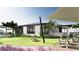 Exterior of clubhouse featuring playground, putting green, lakeside lounge and lawn at 18421 Vista Park Ter, Venice, FL 34293