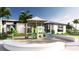 Exterior view of clubhouse and playground, with white brick perimeter at 18421 Vista Park Ter, Venice, FL 34293