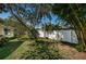 Backyard is fenced in with lush landscaping, offering a private and peaceful outdoor space at 2020 58Th N Way, Clearwater, FL 33760