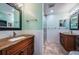 Bathroom featuring a vanity with granite countertop, large mirror and decorative touches at 2020 58Th N Way, Clearwater, FL 33760