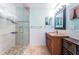 Bathroom featuring a glass enclosed shower and a vanity with granite countertop at 2020 58Th N Way, Clearwater, FL 33760