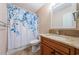 Bathroom featuring a tiled vanity, granite countertop, and a framed mirror over the sink at 2020 58Th N Way, Clearwater, FL 33760