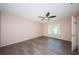 Comfortable bedroom with hardwood flooring and a ceiling fan at 2020 58Th N Way, Clearwater, FL 33760