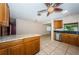 Bright kitchen area with a ceiling fan, granite countertops, stainless steel appliances and tile flooring at 2020 58Th N Way, Clearwater, FL 33760