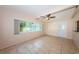 Spacious living area with large windows providing ample natural light at 2020 58Th N Way, Clearwater, FL 33760