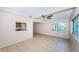 Open-concept living room with pass through to the kitchen area at 2020 58Th N Way, Clearwater, FL 33760