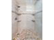 An elegant shower with mosaic tile accents and a glass partition is ready for its new owners at 2020 58Th N Way, Clearwater, FL 33760