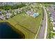 Aerial view of community featuring a pool, dog park, and a lake nearby at 2022 Hawks View Dr, Ruskin, FL 33570