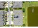 Overhead view of residences and a pond, solar panels on roofs, providing a serene living environment at 2022 Hawks View Dr, Ruskin, FL 33570