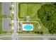 Aerial view of community amenities including a pool, playground, and dog park surrounded by homes at 2022 Hawks View Dr, Ruskin, FL 33570