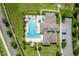Aerial view of community featuring a pool, parking and a walkway at 2022 Hawks View Dr, Ruskin, FL 33570