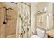 Neutral bathroom features a tiled shower with rain shower head and a modern shower curtain at 2022 Hawks View Dr, Ruskin, FL 33570