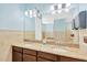 Community bathroom with double sinks, granite counters, and ample lighting at 2022 Hawks View Dr, Ruskin, FL 33570