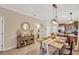 Dining room showcases a charming buffet, a wooden table set for guests, and hanging light fixtures at 2022 Hawks View Dr, Ruskin, FL 33570