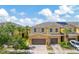 Lovely townhome with a two-car garage, enhanced by manicured landscaping and modern solar panels at 2022 Hawks View Dr, Ruskin, FL 33570