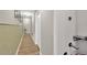 Hallway with wood floors, modern wall decor and a sleek design at 2022 Hawks View Dr, Ruskin, FL 33570