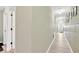 Long hallway featuring light-colored floors and neutral walls at 2022 Hawks View Dr, Ruskin, FL 33570
