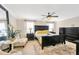 Bright main bedroom with a large mirror, bedside tables, large dresser, and a ceiling fan at 2022 Hawks View Dr, Ruskin, FL 33570